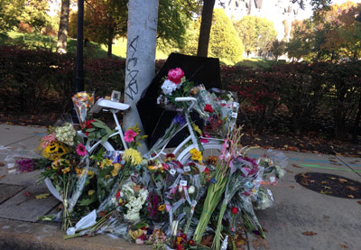 A "ghost bike" to honor the woman killed at a red light while waiting on her bicycle was installed during a memorial service organized by Bike Pittsburgh.